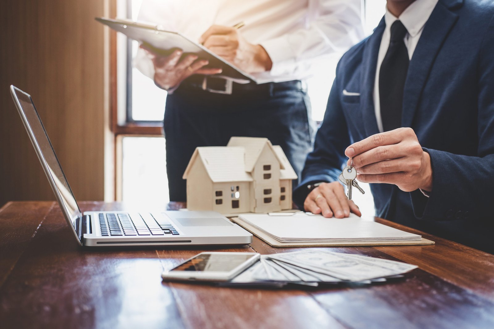 Real estate agent and Sales manager team analysis pricing of rental lease contract of sale purchase agreement, concerning mortgage loan offer for and house insurance.